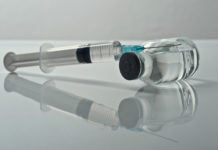 What needs to go right to get a coronavirus vaccine quickly Photo of a syringe and vial of medicine