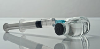 Photo of a syringe and vial of medicine