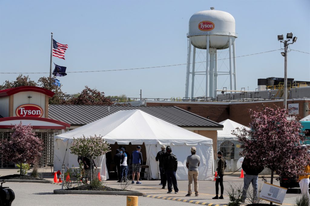 Photo of meat plant workers being screened