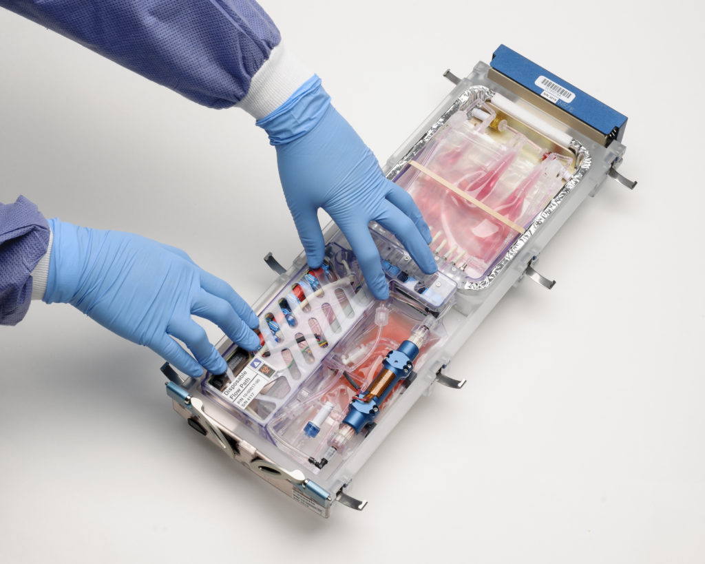 Photo of technician assembling cell-study equipment