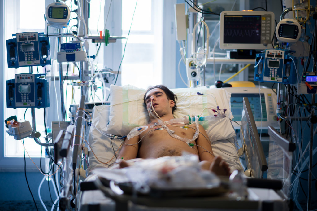 Photo of mail Covid patient in hospital bed