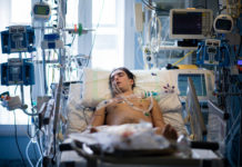 Photo of mail Covid patient in hospital bed