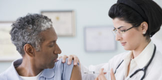 Photo of person receiving a vaccine injeciton