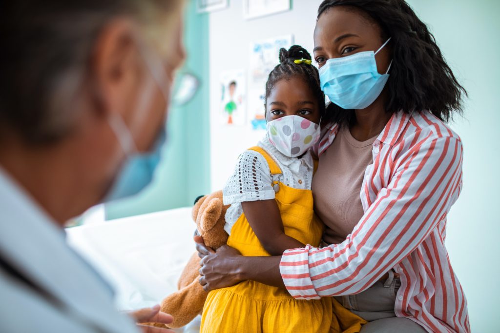Photo of a Mother and Daughter visiting the doctor