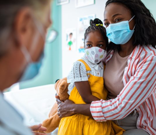 Photo of a Mother and Daughter visiting the doctor