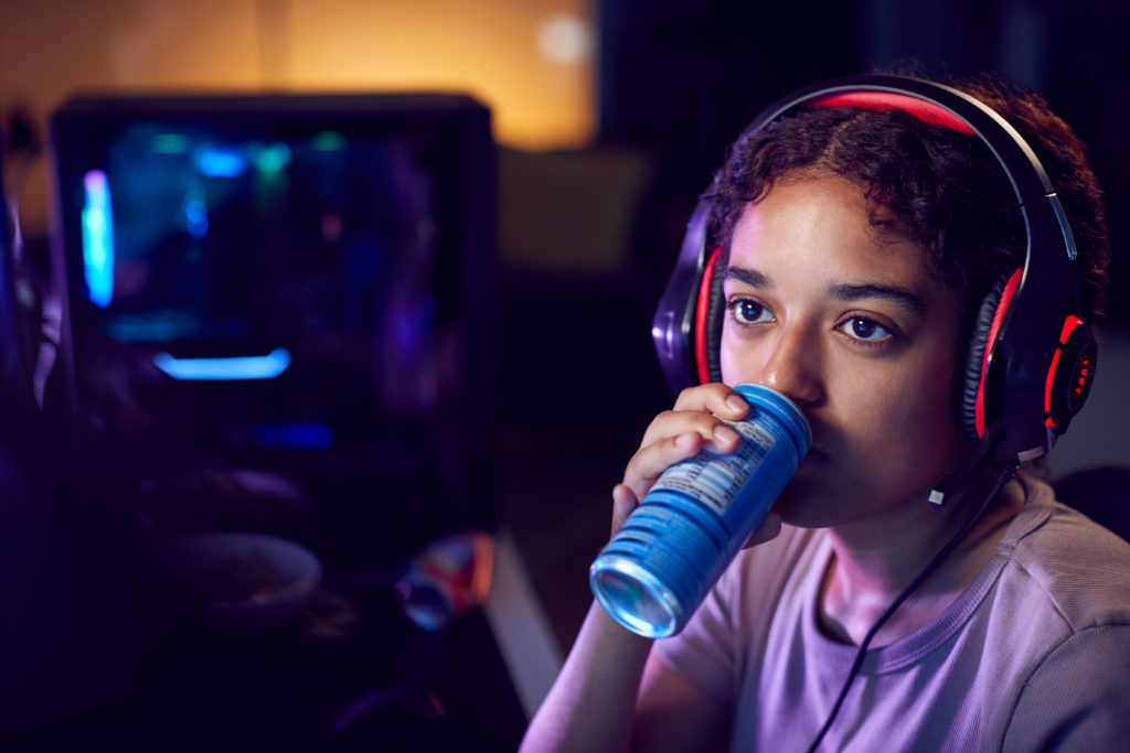 Photo of teenager drinking an energy drink