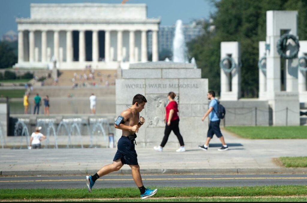 Photo of jogger running through the city