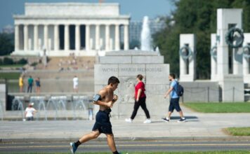 Photo of jogger running through the city