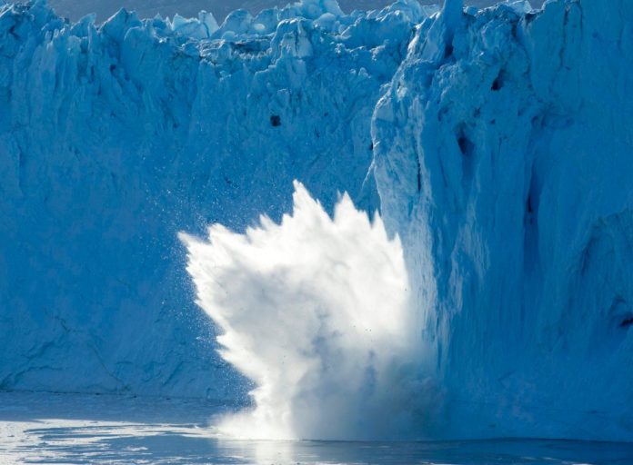 GlacierIceCalving Photo of an iceberg breaking off of a glacier