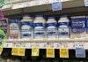 Photo of bottles of glucosamine tablets on a store shelf