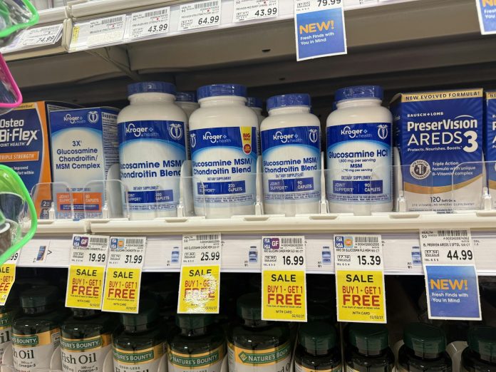 Photo of bottles of glucosamine tablets on a store shelf